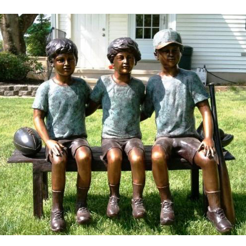 garden bronze rugby sculpture sitting on bench 
